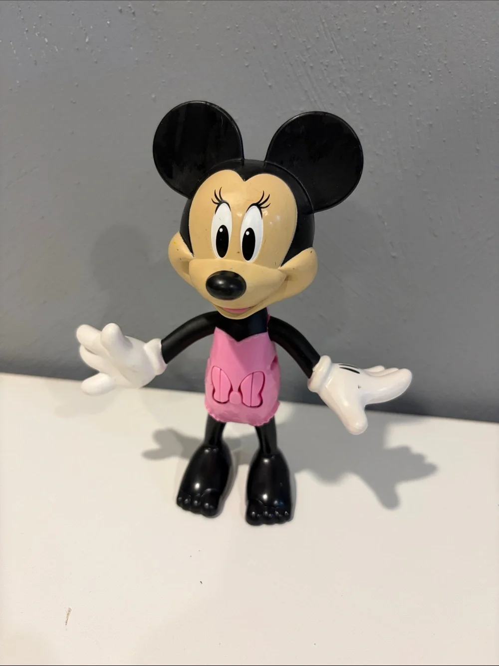 Minnie Mouse with push button arms and head figurine